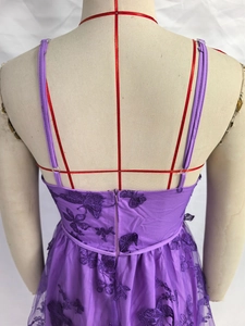 Detail of purple tulle dress showing exquisite floral embroidery and invisible back zipper