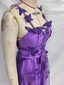 Detailed view of purple tulle bridal gown with 3D butterfly appliques and waist tie