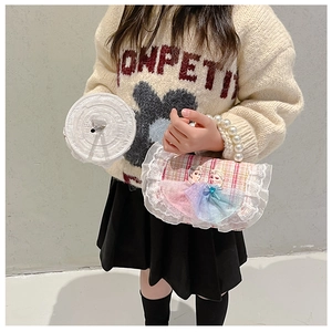 Detail of pink plaid girls' bag featuring Elsa embroidery and pearl top handle