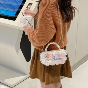 Pink tweed girls mini crossbody bag with pearl handle, lace trim, and bow decoration