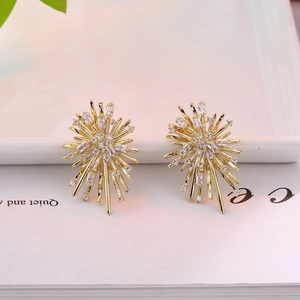 Elegant gold-plated firework zircon stud earrings displayed on a minimalist background