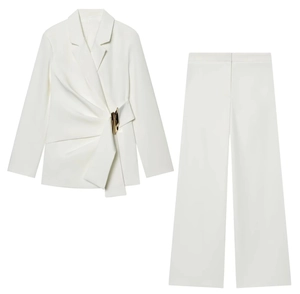 Detail of white blazer set with side pleats and golden metal buckle decoration