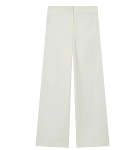 Detail of high-waist wide-leg cream trousers with premium draped fabric texture