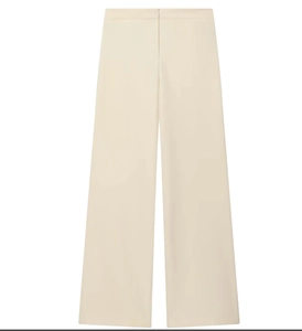 Detail of high-waisted wide-leg trousers in cream white with a smooth drape and clean cut