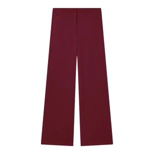 Detailed flat lay of burgundy high-waisted wide-leg suit trousers with smooth drape texture