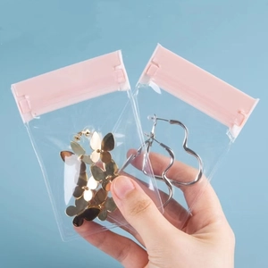 Transparent jewelry storage bags with pink zippers for earrings and necklace protection