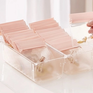 Pink jewelry storage bags set with clear acrylic organizers for earrings and rings