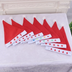 Set of eight red plush Christmas hats with unique LED light patches and holiday decors