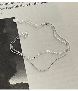 Detail of 925 sterling silver double-layer bracelet with snake chain and lobster clasp