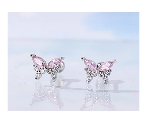 Macro view of S925 silver butterfly earrings with pink and white cubic zirconia
