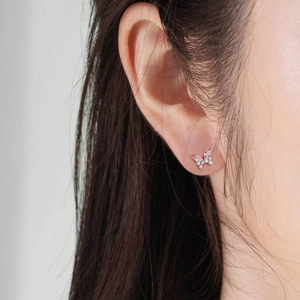 S925 silver butterfly stud earring with pink and white zirconia gems on model