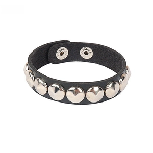 Detail of punk gothic black PU leather bracelet featuring silver dome stud rivets and snaps
