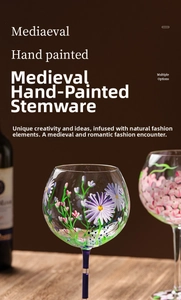 Macro detail of hand-painted floral motifs on vintage style long-stem wine glasses