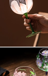 Detail of hand-painted floral patterns and colored stems on elegant glass wine goblets