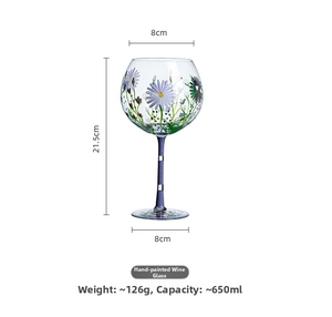 Detailed view of hand-painted floral wine glass with dimensions 21.5cm high and 650ml volume