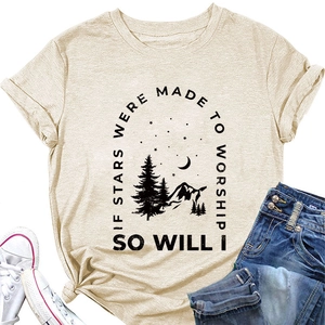Close-up of mountains and starry sky print on beige cotton blend t-shirt fabric