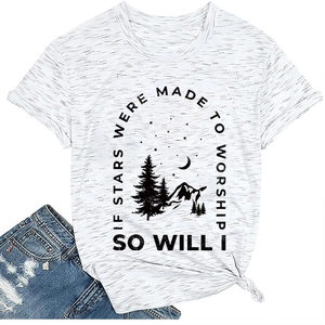 Detail of casual t-shirt with mountain moon print and worship quote on fabric