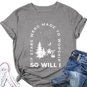 Detail of grey T-shirt with white mountain and stars print in a casual lifestyle layout
