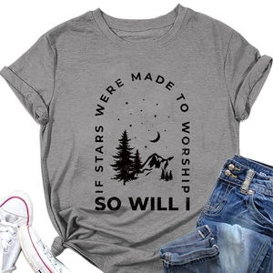 Detailed flat lay of a grey t-shirt featuring mountain graphics and nature text prints