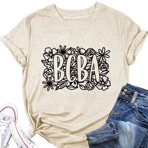 Flat lay of light beige BCBA floral graphic tee with jeans and white canvas shoes