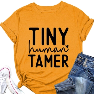 Detail of yellow cotton t-shirt with tiny human tamer text and casual summer styling