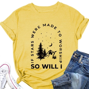 Detail of mustard yellow cotton T-shirt featuring mountain and star graphic print