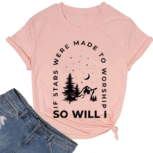 Detail of pink T-shirt featuring a mountain print and stylish front knot hem design