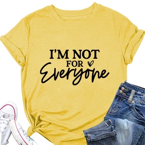 Detailed close-up of yellow cotton t-shirt fabric with I'M NOT FOR EVERYONE text