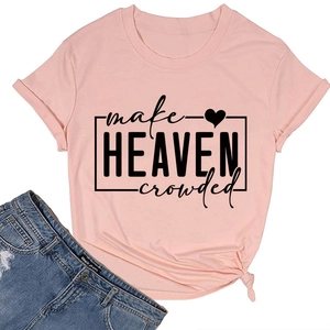 Detail of light pink T-shirt featuring black printed lettering and stylish side-knot hem