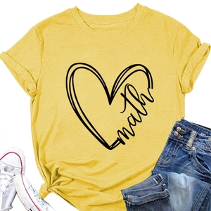 Flat lay of a yellow heart math t-shirt with rolled sleeves and a stylish side knot