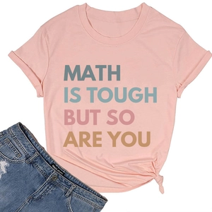 Flat lay of pink cotton T-shirt with 'Math is tough but so are you' slogan and denim shorts