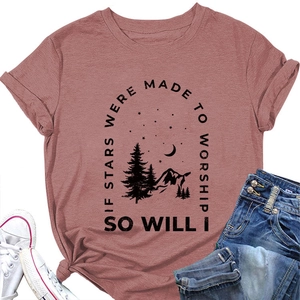 Close-up of Dusty Rose T-shirt with mountain graphic and stars made to worship text