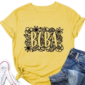 Close-up of yellow BCBA floral T-shirt featuring rolled sleeves and a stylish front knot