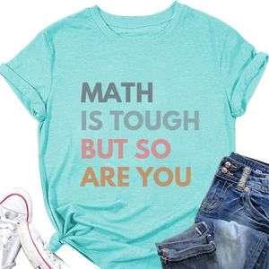 Flat lay of cyan T-shirt with 'MATH IS TOUGH BUT SO ARE YOU' print and denim jeans