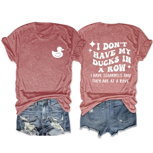Flat lay of a red cotton T-shirt with back print and ripped blue denim shorts set
