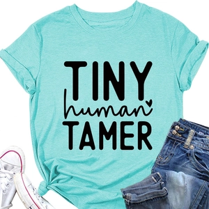 Detail of mint green cotton T-shirt featuring TINY human TAMER print and heart graphic