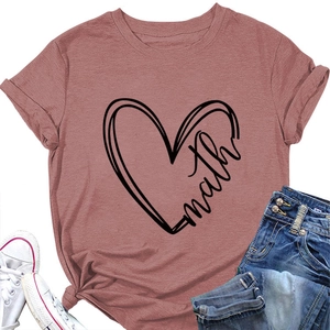 Detailed flat lay of pink t-shirt with heart math print, white shoes and blue jeans