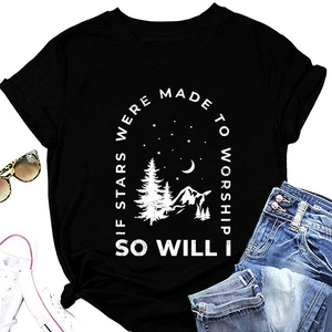 Flat lay of black cotton t-shirt with mountain and star graphic for casual wear