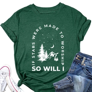 Flat lay of dark green T-shirt with mountain print, styled with sneakers and jeans