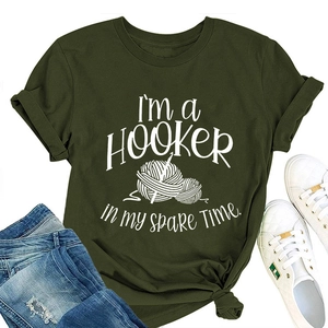 Army green t-shirt flat lay with crochet theme print and knot detail at the hem