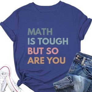Flat lay of navy blue T-shirt with 'Math is Tough' print styled with jeans and sneakers