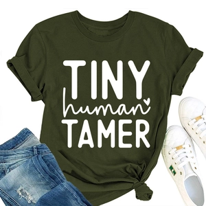 Close-up of Tiny Human Tamer graphic print on dark green cotton crew neck t-shirt