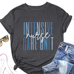Flat lay of charcoal grey nurse t-shirt paired with denim shorts and sneakers