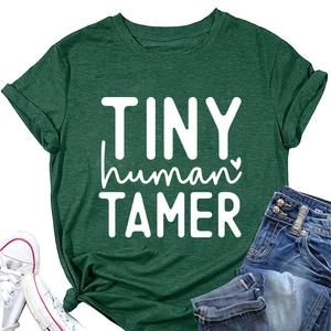 Close-up of Forest Green Tiny Human Tamer T-shirt with white lettering and soft texture