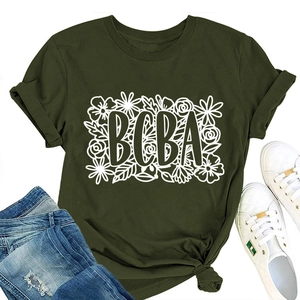 Detailed flat lay of olive green BCBA floral t-shirt with blue jeans and white sneakers