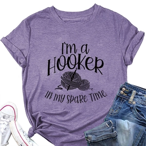 Flat lay of purple crochet lover T-shirt with jeans and shoes on white background