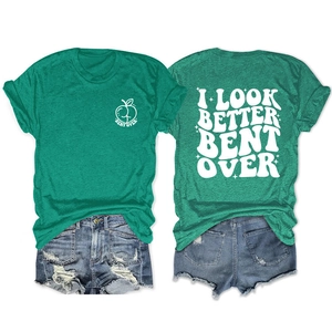 Detail of forest green T-shirt featuring double-sided print and casual denim shorts