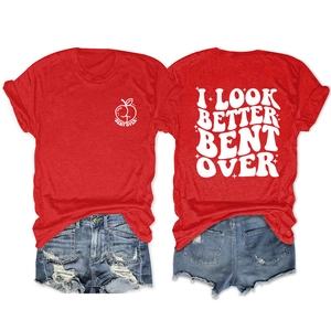 Detail of red T-shirt with white letter prints and distressed blue denim shorts