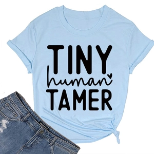 Close-up of light blue t-shirt with tiny human tamer text and side knot detail