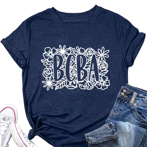 Flat lay of navy blue BCBA floral print T-shirt with denim jeans and white sneakers
